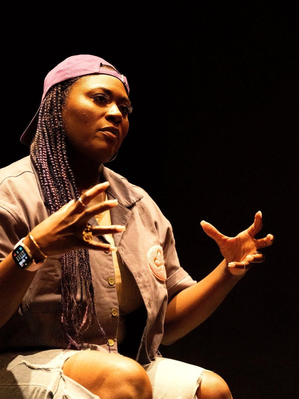 Danielle Brooks on stage, talking with her hands.