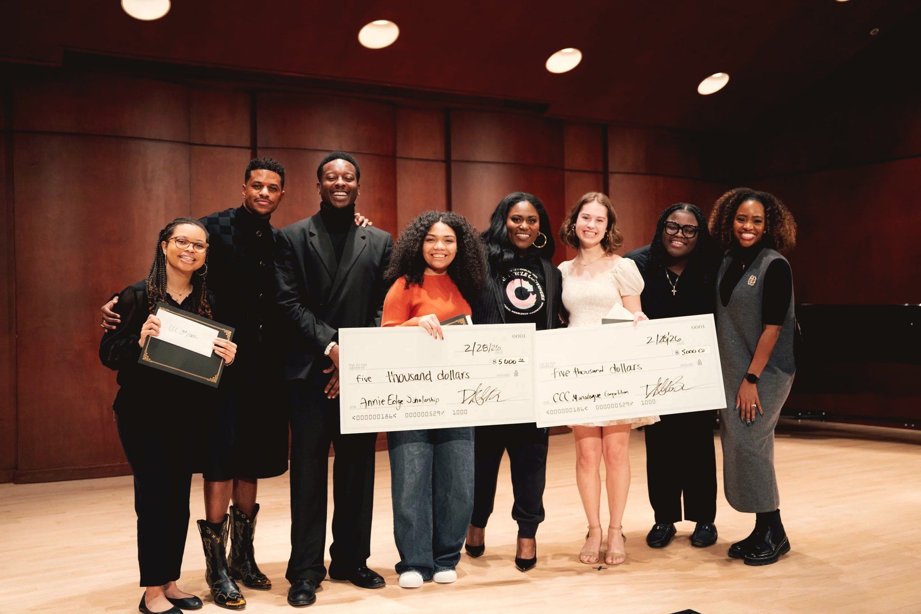 The judges, Danielle Brooks and the 2026 winners on stage, holding their checks.